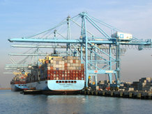 Ship in at the container terminal loaded by a STS Container Crane